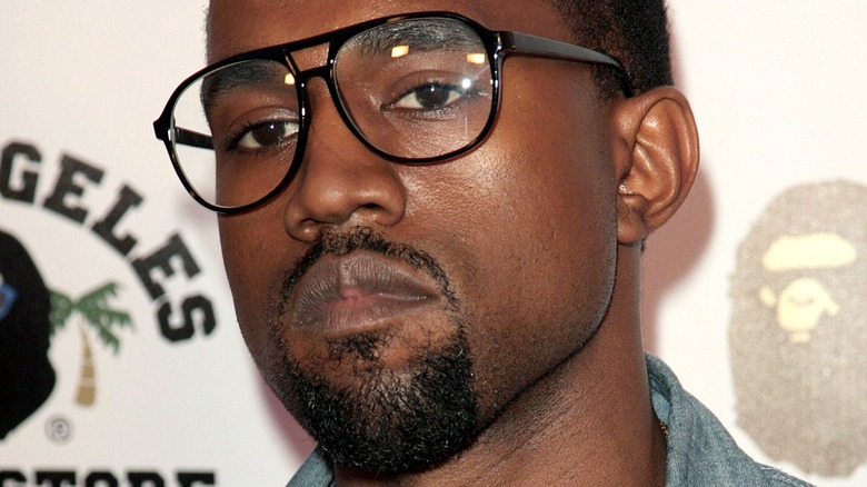 Kanye West wearing glasses 