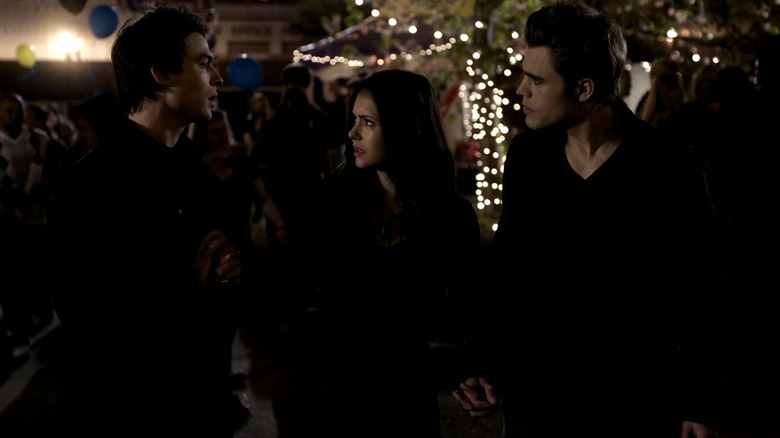 Elena (Nina Dobrev) caught between Damon (Ian Somerhalder) and Stefan (Paul Wesley) in "The Vampire Diaries"