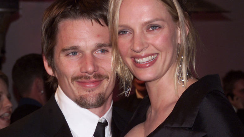 Ethan Hawke and Uma Thurman smiling cheek to cheek
