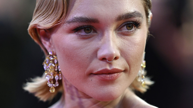 Florence Pugh wearing chandelier earrings