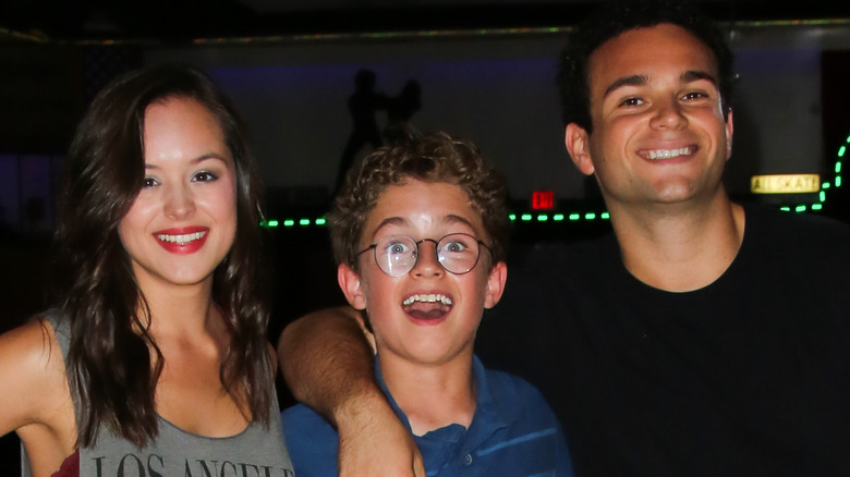 Hayley Orrantia, Sean Giambrone, and Troy Gentile at "The Goldbergs" press event at the Moonlight Rollerway