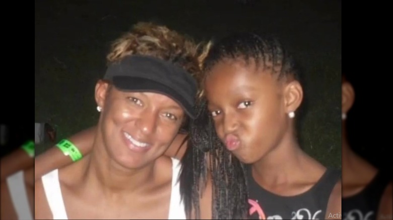 Angel Reese and Angel Webb Reese posing
