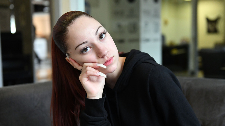 Bhad Bhabie with hand resting on face