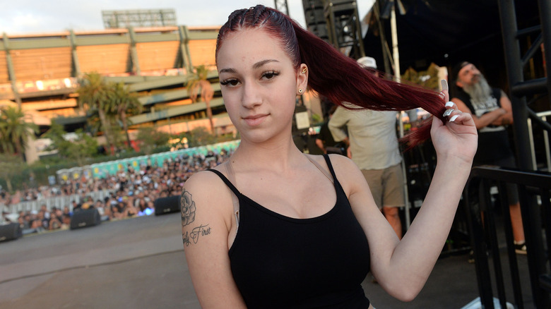 Danielle Bregoli twirling her red ponytail