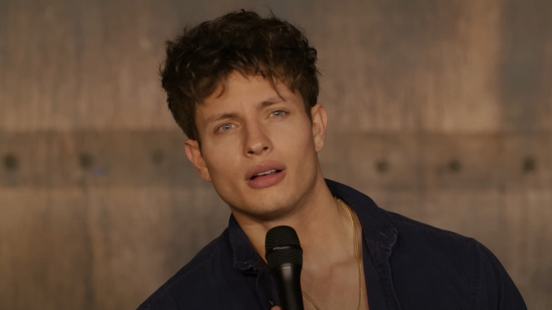Matt Rife holding microphone
