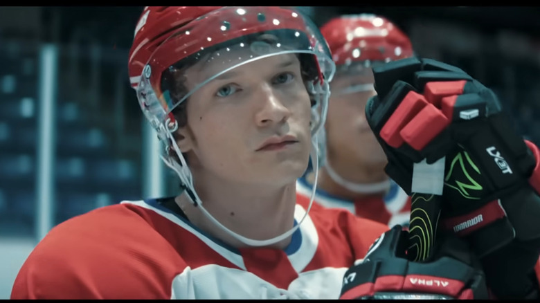 Conor Storrie in hockey gear in character as Ilya Rozanov in "Heated Rivalry"