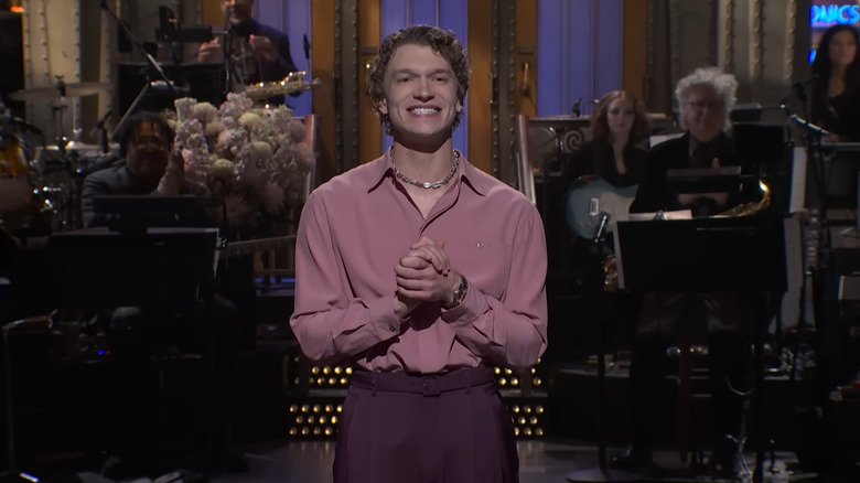 Connor Storrie smiling while hosting "Saturday Night Live"