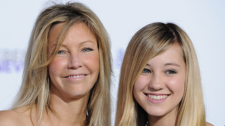 Heather Locklear and her daughter Ava Sambora posing together at an event