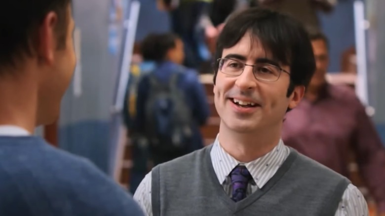 John Oliver waving red carpet