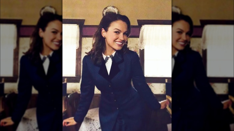 Kayla Wallace posing on the set of 'When Calls the Heart.'