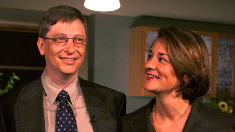 Melinda Gates affectionately gazes at Bill Gates while smiling.