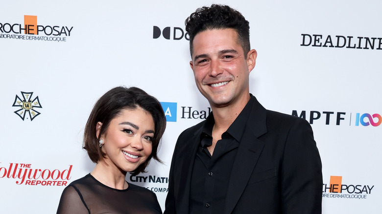 Sarah Hyland and Wells Adams grinning
