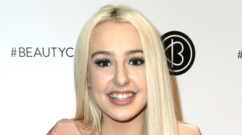 Tana Mongeau posing on red carpet