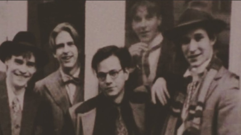 Noah Wyle in costume on the set of Swing Kids in a trenchcoat and scarf