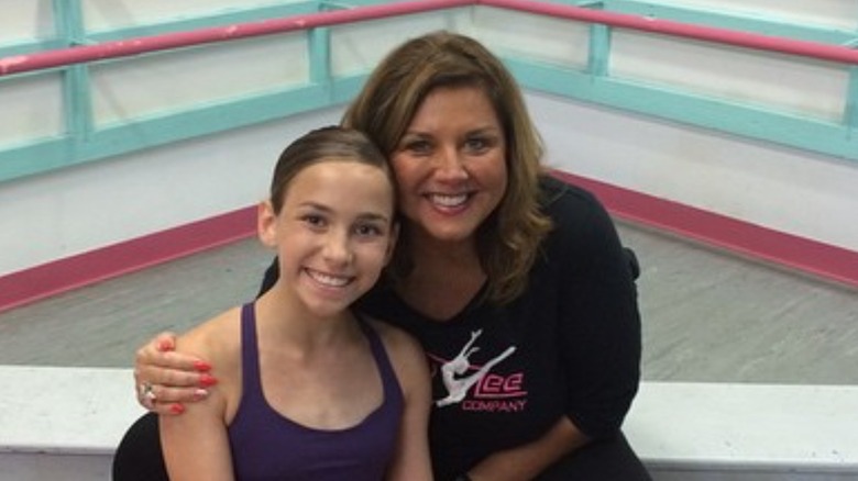Katie Feeney posing with Abby Lee Miller