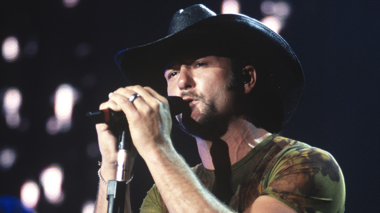 Tim McGraw in concert, wearing a black cowboy hat