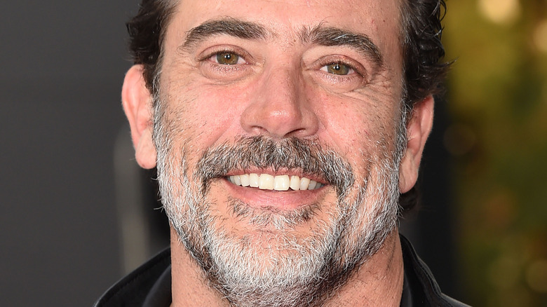 Jeffrey Dean Morgan smiles in a black jacket