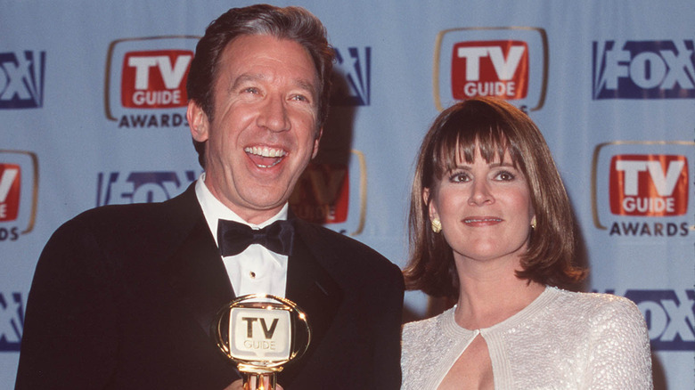 Tim Allen and Patricia Richardson posing together.