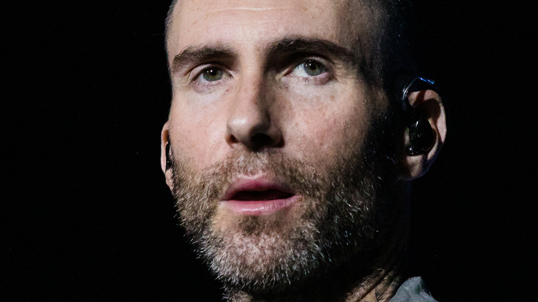 Adam Levine stares off into the distance