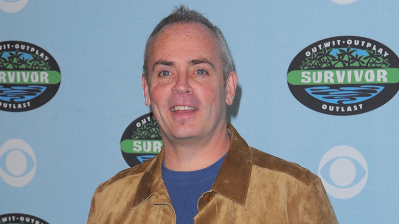 Richard Hatch with Survivor logos