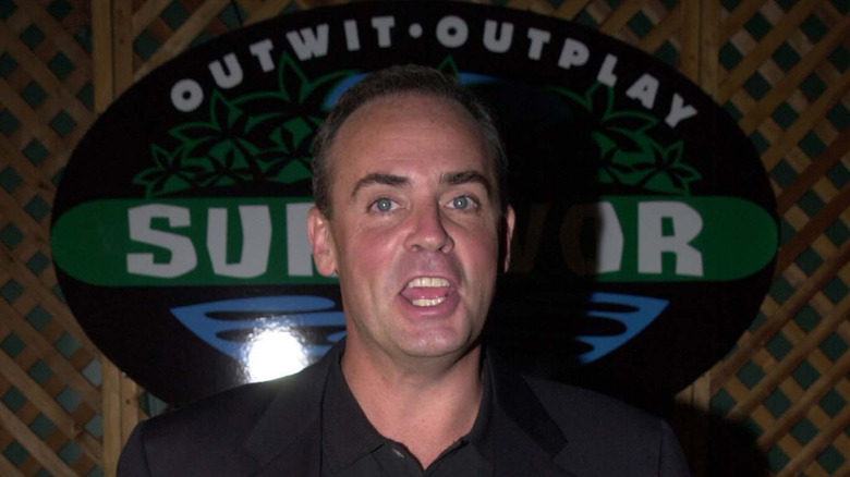 Richard Hatch with Survivor logo