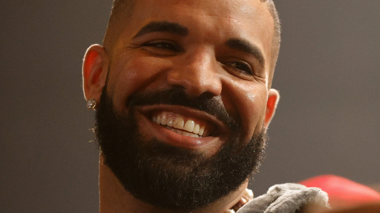 Drake smiles on stage