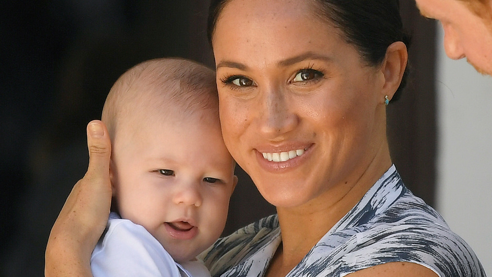 Meghan Markle, Prince Harry, and baby Archie pose together