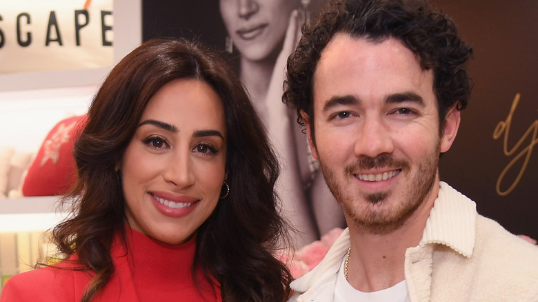 Kevin and Danielle Jonas posing