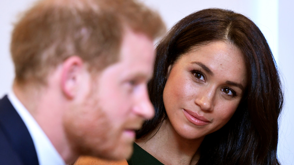 Meghan Markle looking at Prince Harry during an event