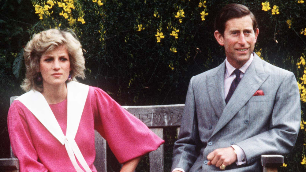 Princess Diana and Prince Charles posing for a photo during her pregnancy with Prince Harry