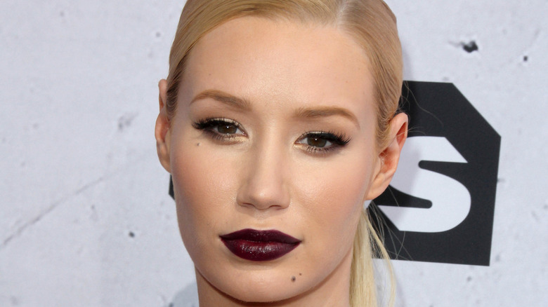 Iggy Azalea posing in dark lipstick