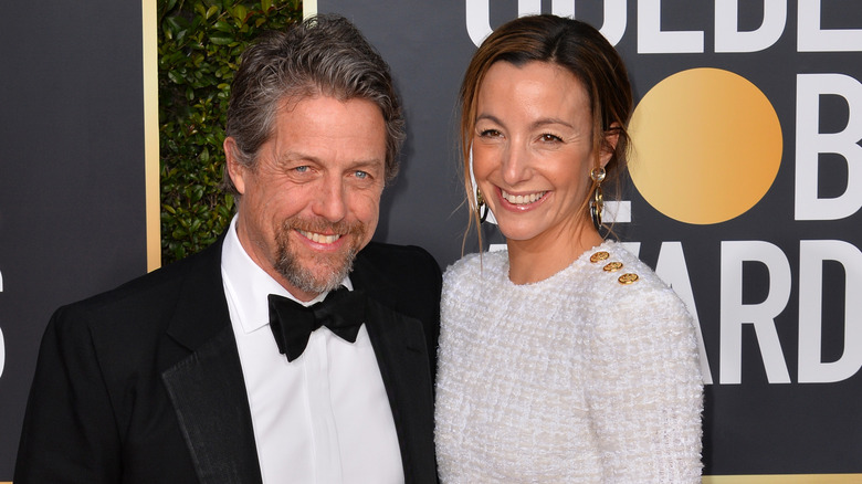 Hugh Grant and Anna Eberstein smiling 