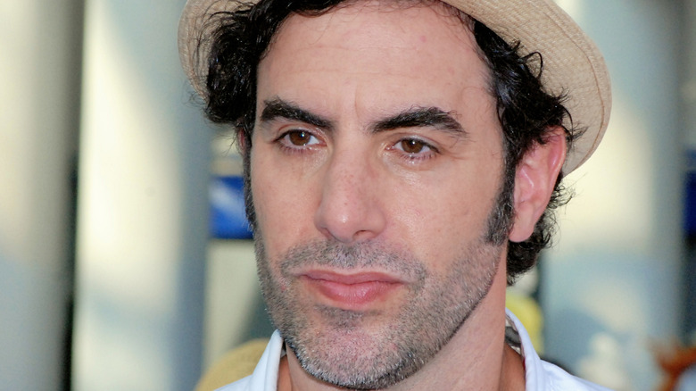 Sacha Baron Cohen in tan fedora