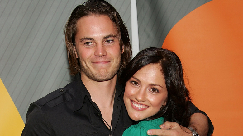 Taylor Kitsch and Minka Kelly smiling