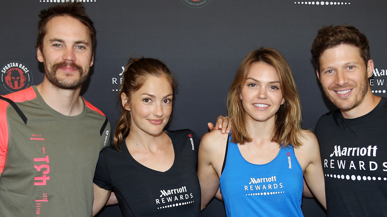 Taylor Kitsch, Minka Kelly, Aimee Teegarden, and Zach Gilford smiling