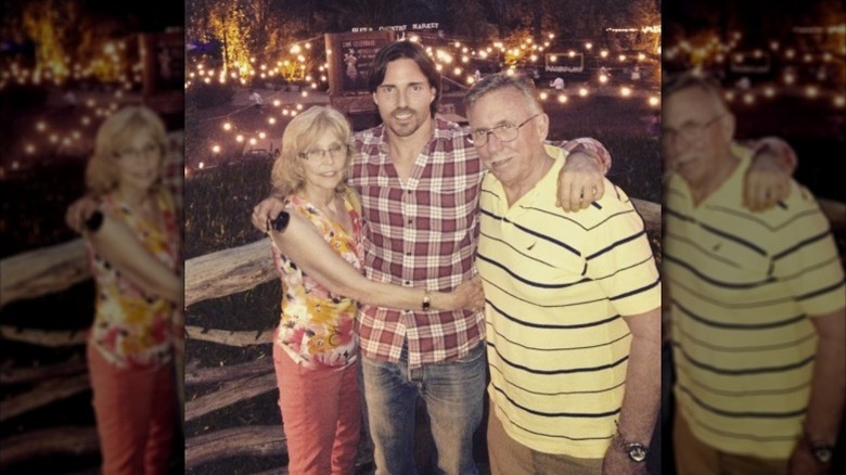Aaron Phypers poses with his parents