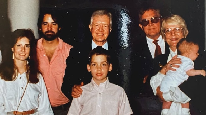 Young Clint Harp poses with Jimmy Carter