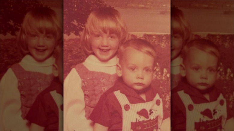 Young Clint Harp poses with his sister