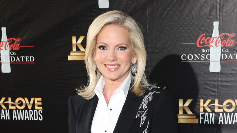 Shannon Bream smiles on a red carpet.