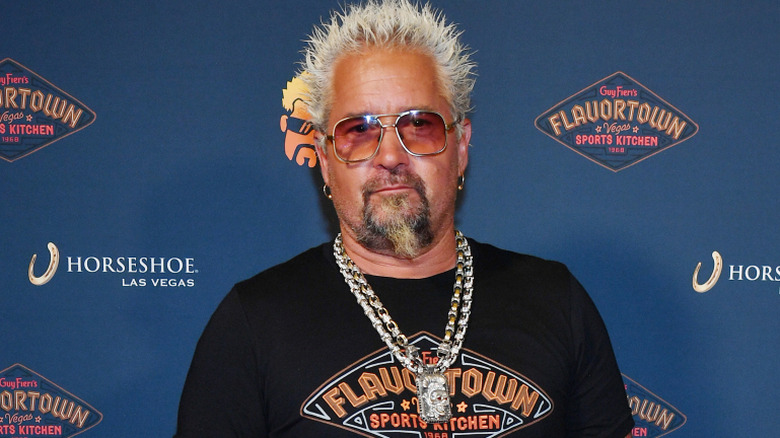 Guy Fieri wearing Flavortown on red carpet