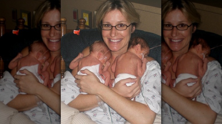 Jenny Marrs holds her twins in the NICU