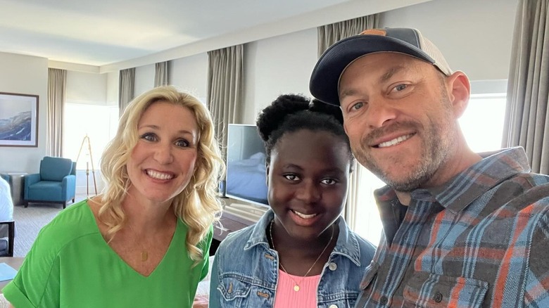 Jenny and Dave Marrs pose with Sylvie