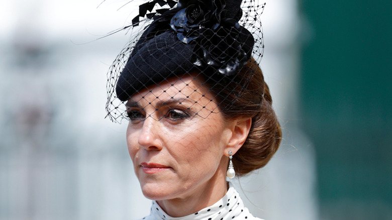 Kate Middleton wearing a black fascinator
