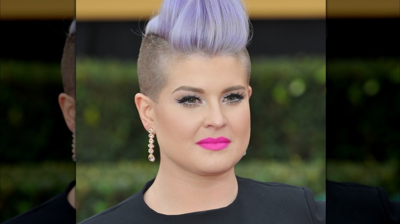 Kelly Osbourne poses for a photo