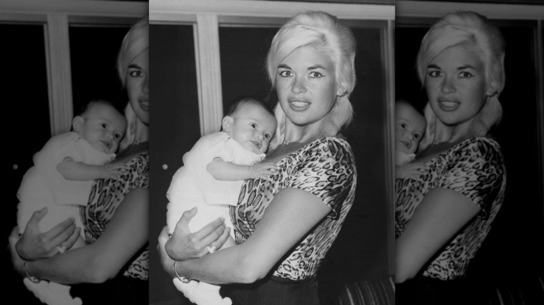 Jayne Mansfield holds newborn Mariska Hargitay in 1964