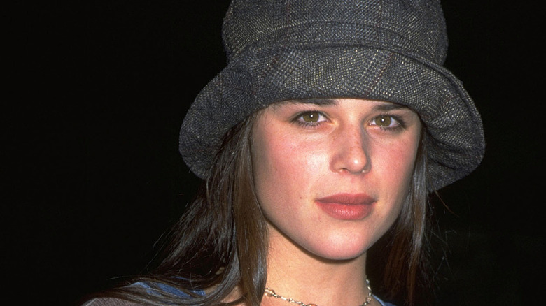 Neve Campbell wearing a hat