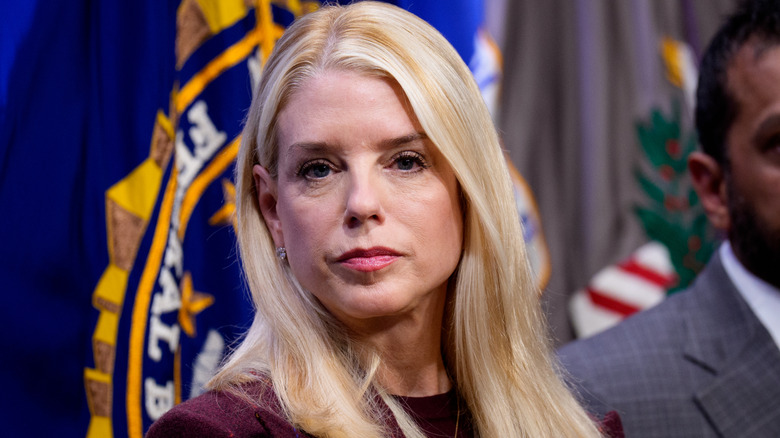 Pam Bondi looks on during a news conference.