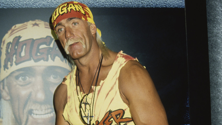 Hulk Hogan posing in front of a large posterof himself