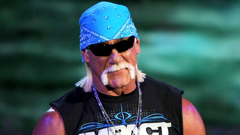 Hulk Hogan wearing dark sunglasses and a blue bandana