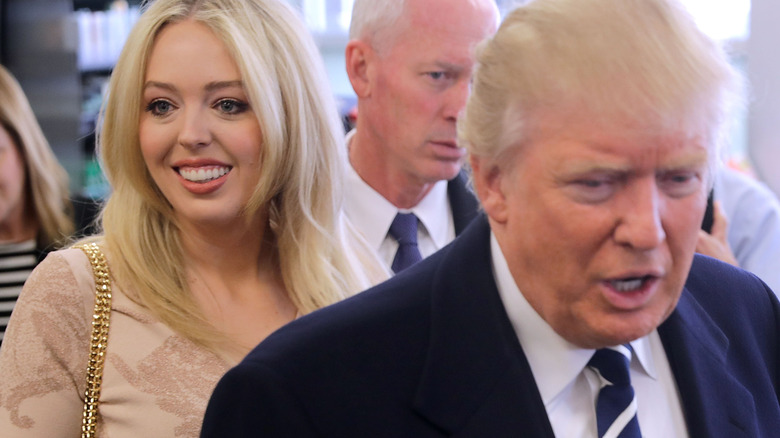 Tiffany and Donald Trump walking